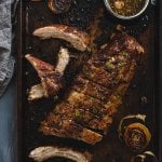 Roasted pork ribs on a metal baking sheet