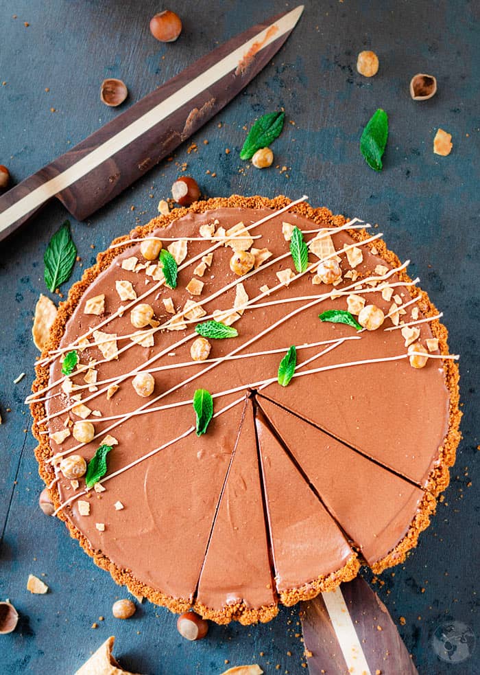 Overhead shot of sliced chocolate tart.