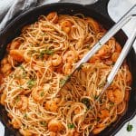 Angel hair pasta with spicy shrimp scampi in a cast iron skillet