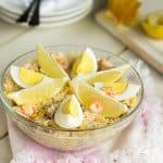 A bowl of shrimp and rice salad.