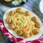 A plate of spaghetti and meatballs