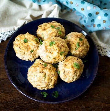 A close up of a plate with bread dumplings