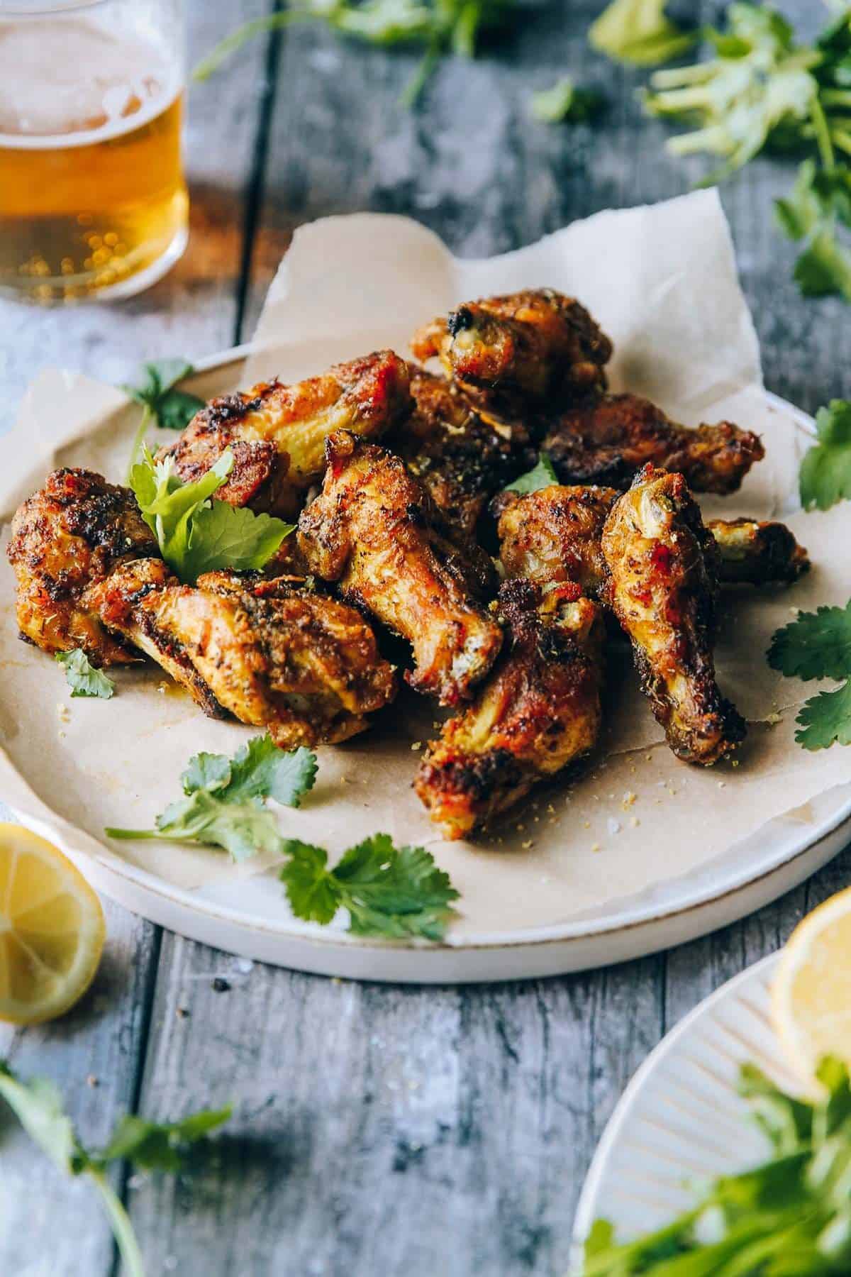 Angle view of the plate with baked wings.