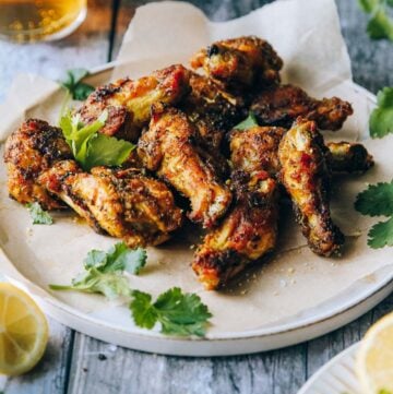 Angle view of the plate with baked wings.