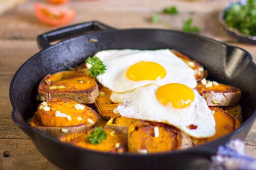 A pan of baked sweet potatoes and eggs.