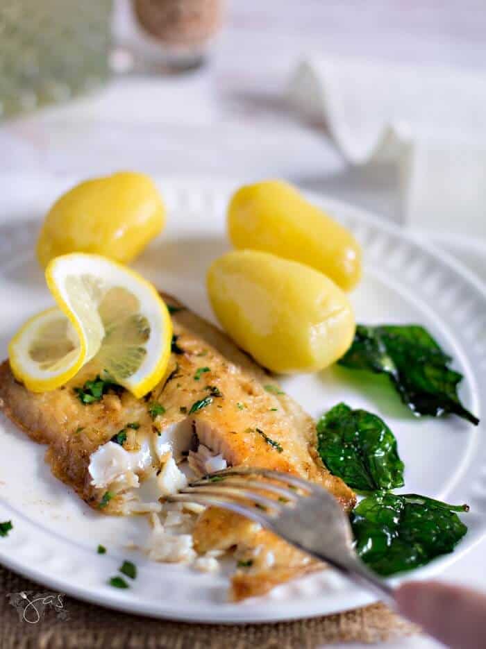 flaking fish with a fork