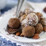 A plate with chocolate balls and spoon