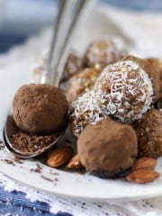 A plate with chocolate balls and spoon