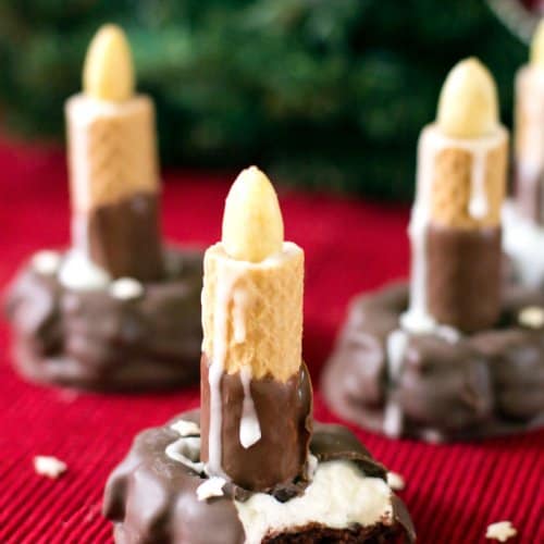 Fudge marshmallow cookies and chocolate wafers on a red tablecloth.