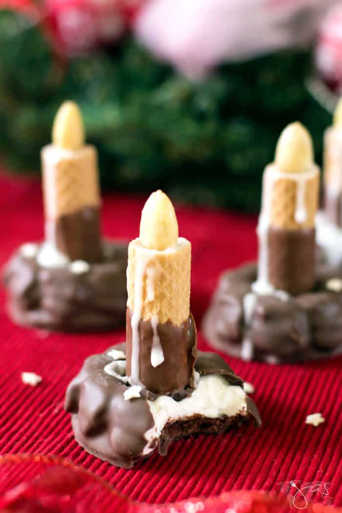 Fudge marshmallow cookies and chocolate wafers on a red tablecloth.