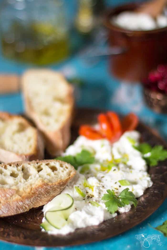 farmer's cheese served with herbs and bread