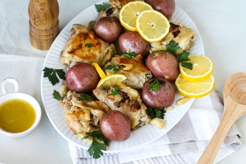 Bunch of food on a white plate sitting on a table