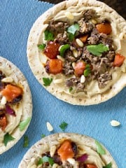 Pitas with hummus and ground lamb.