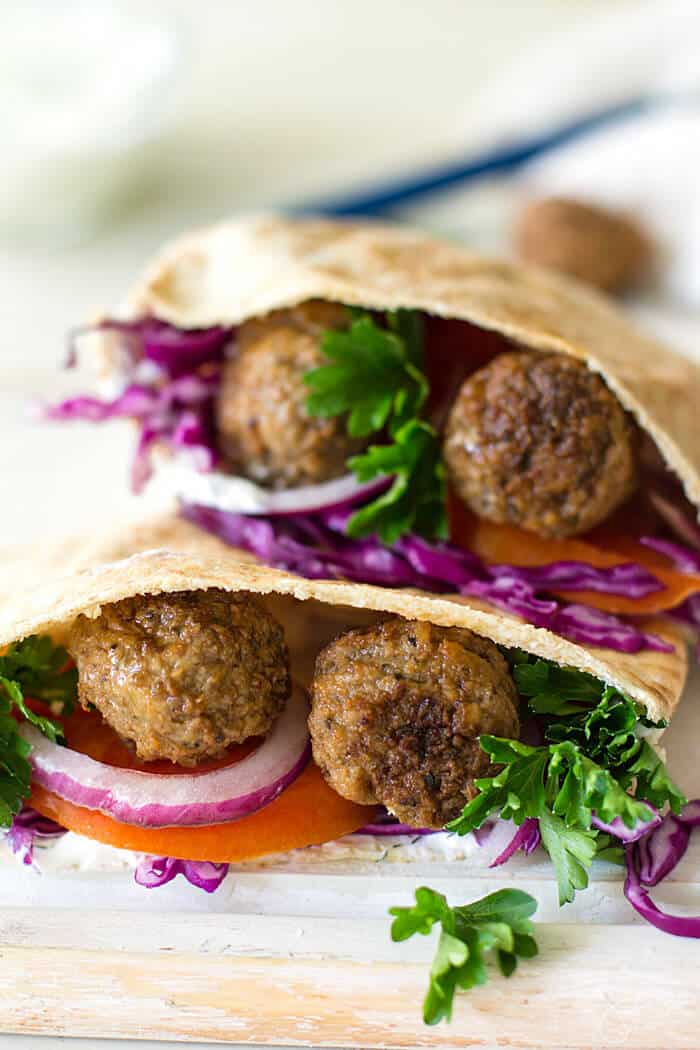 Lamb meatballs in two pita halves.