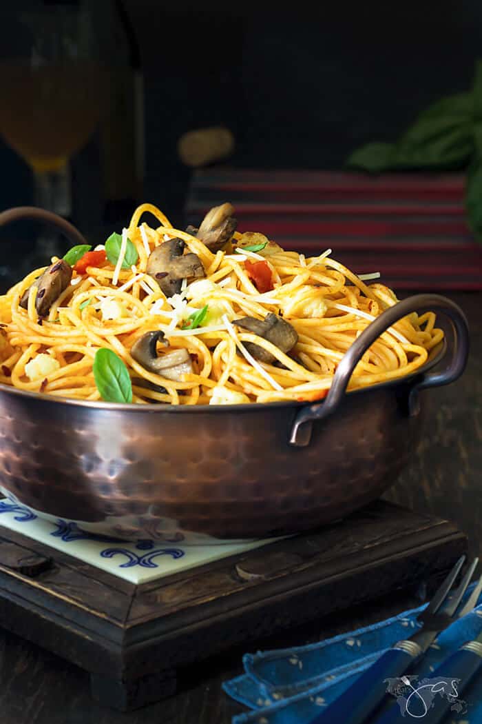 A bowl of food on a table, with Spaghetti and Pasta