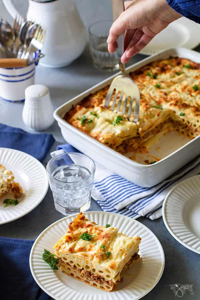 A shot of casserole being served from a casserole pan.