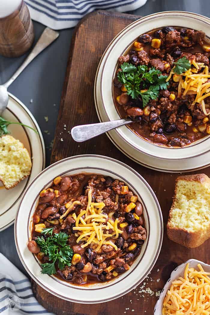 Served chili with beef, beans, and corn.