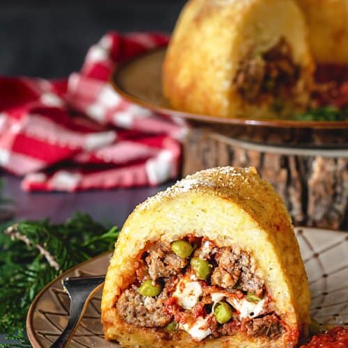 A front shot of sliced Neapolitan Sausage Meatballs and Rice Timbale