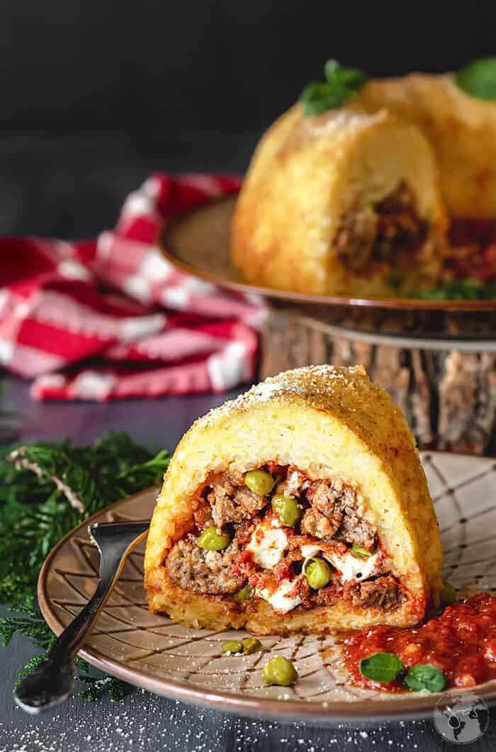 A front shot of sliced Neapolitan Sausage Meatballs and Rice Timbale 