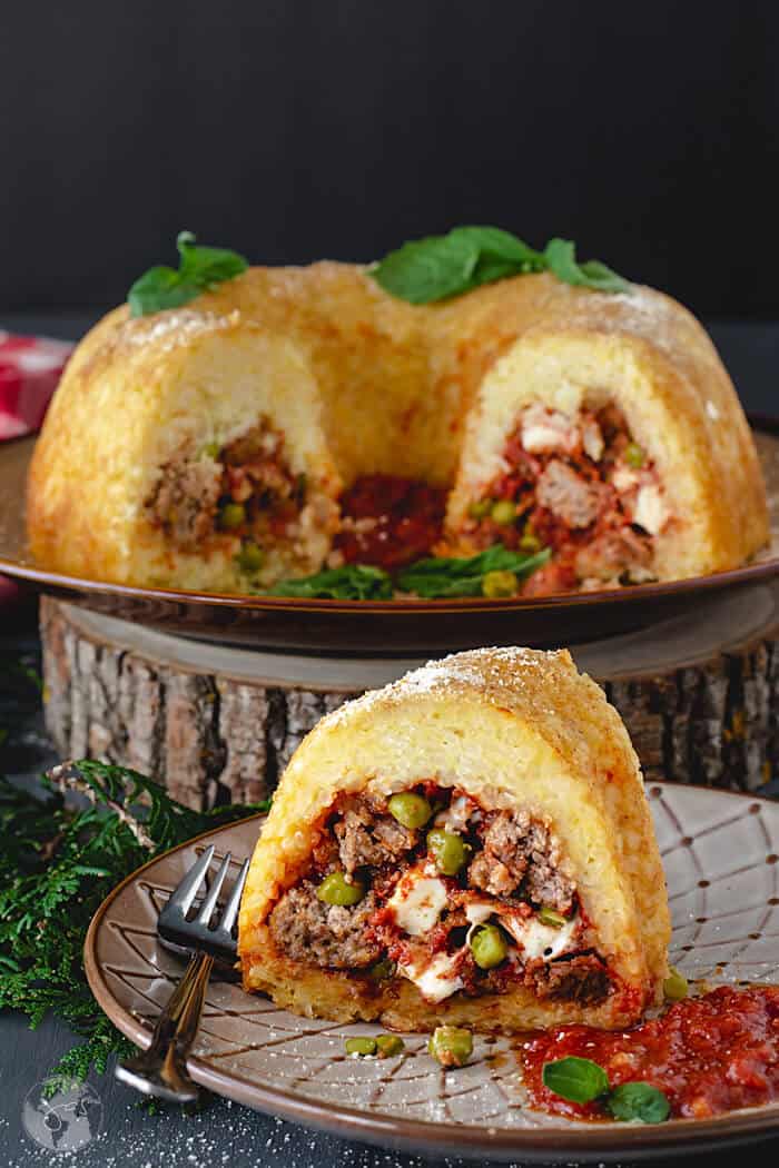 A front shot of rice bundt slice with the rest of the dish in background