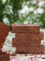 a front shot of no-bake bars stacked on top of each other.