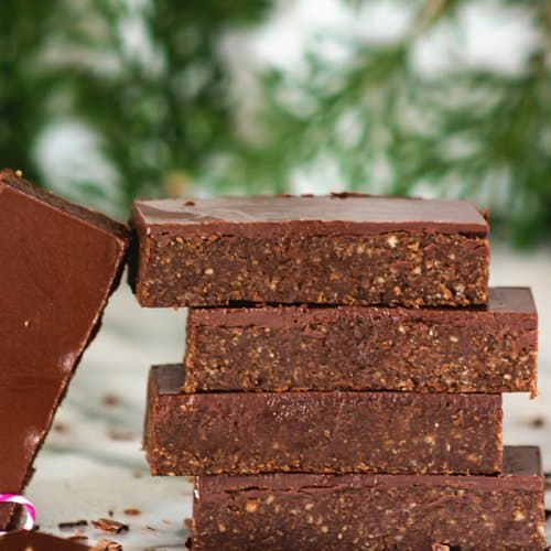 a front shot of no-bake bars stacked on top of each other.