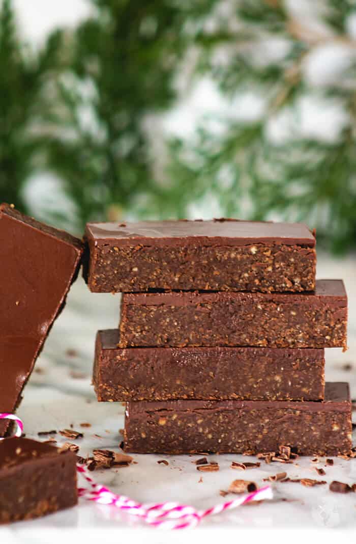 a front shot of no-bake bars stacked on top of each other.