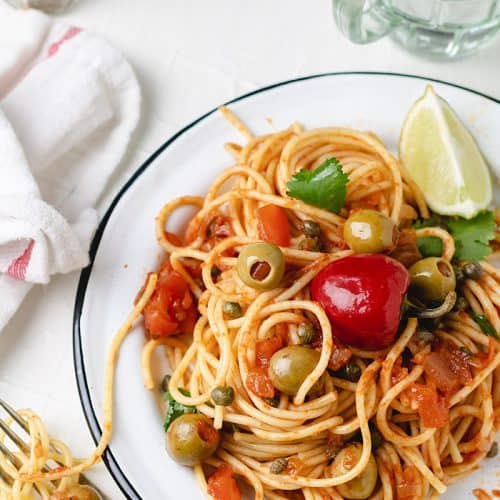 Close up plate of pasta with Mexican tomato sauce.