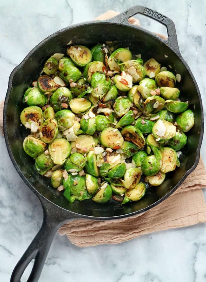brussel sprouts in an iron pan.