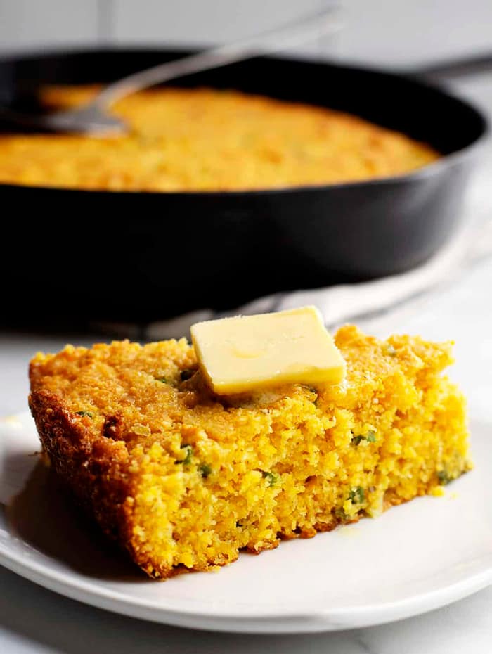 a wedge of cornbread with butter