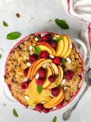 Sweet kugel noodle casserole with sliced peaches and raspberries - overhead