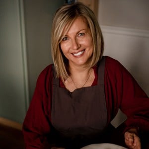 A woman sitting at the table and smiling