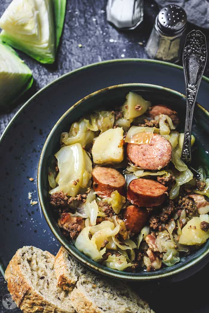 Cabbage, bacon, ground beef, kielbasa, and potatoes make this delicious German stew - Jägerkohl