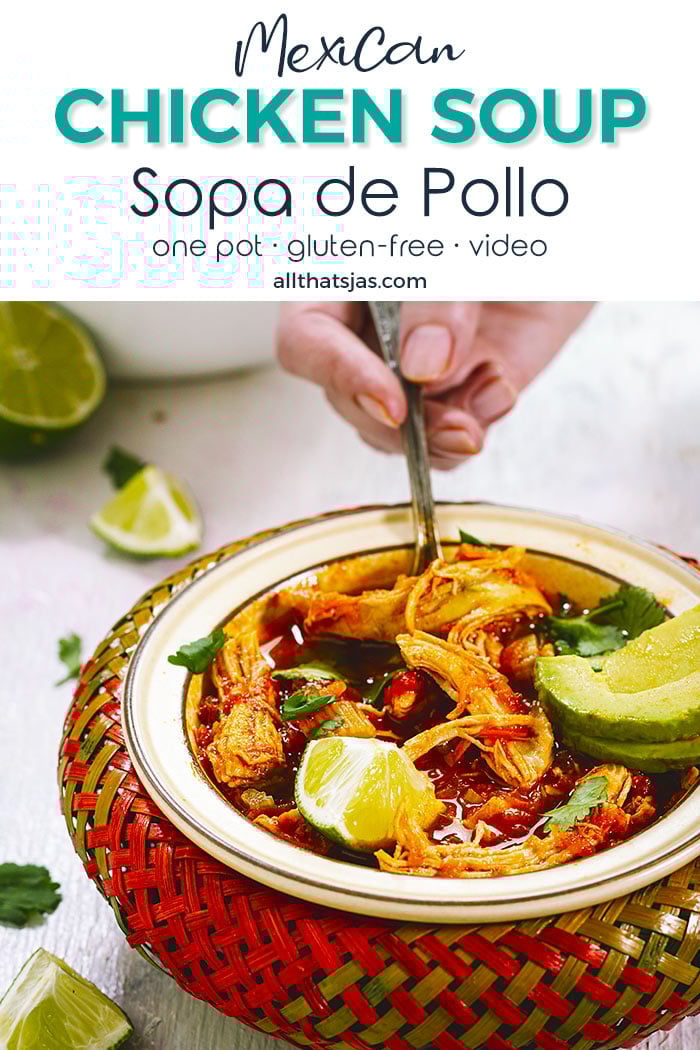 Mexican chicken soup in a colorful bowl, with a hand holding a spoon - with text overlay