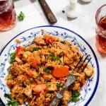 Chicken risotto in a plate with a fork