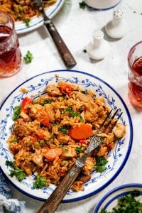 Chicken risotto in a plate with a fork