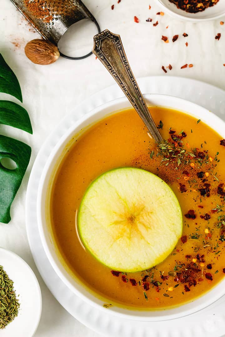 Squash soup with an apple ring and spices. 