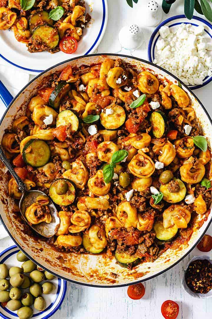 A close up overhead shot of tortellini beef dish in a skillet