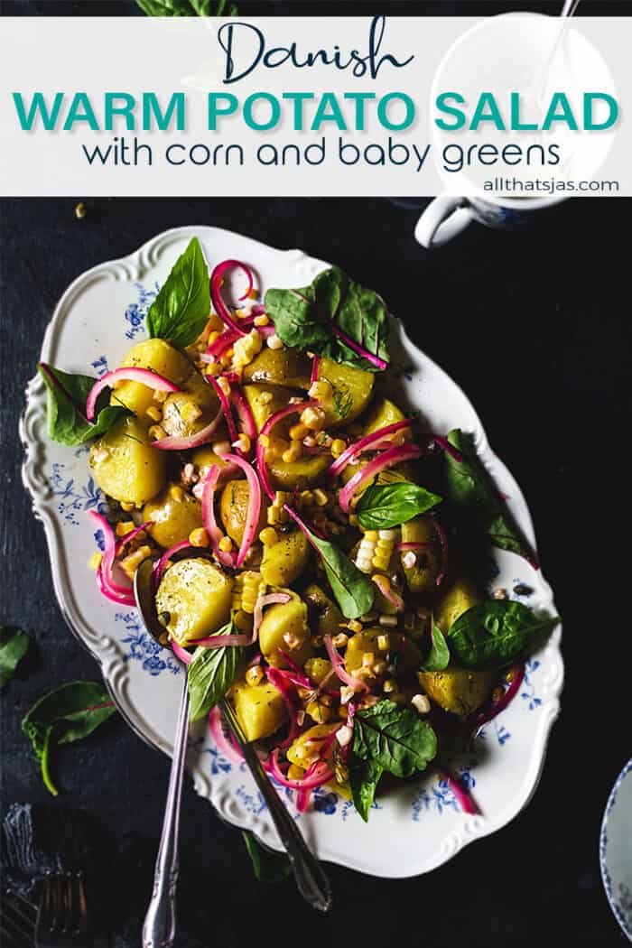 Overhead of Danish salad on an oval platter and black background with text overlay