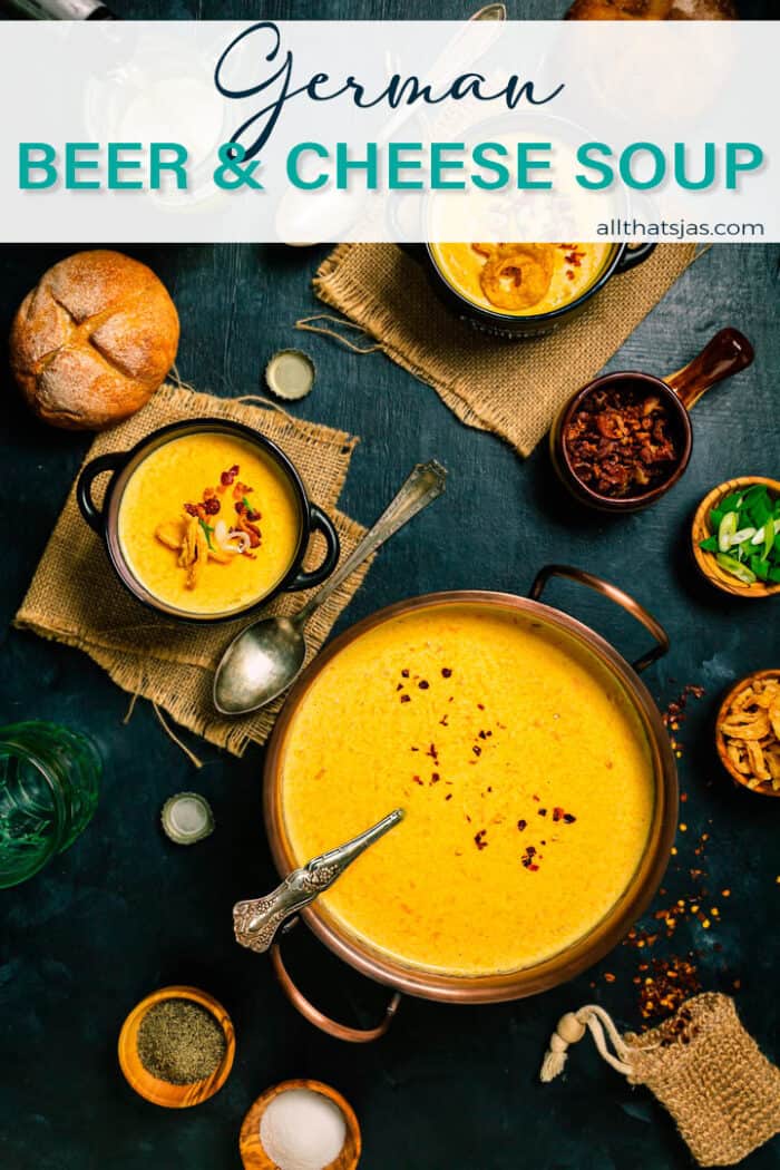 A flat lay shot of the cheese beer soup in a large copper bowl and two servings with text overlay