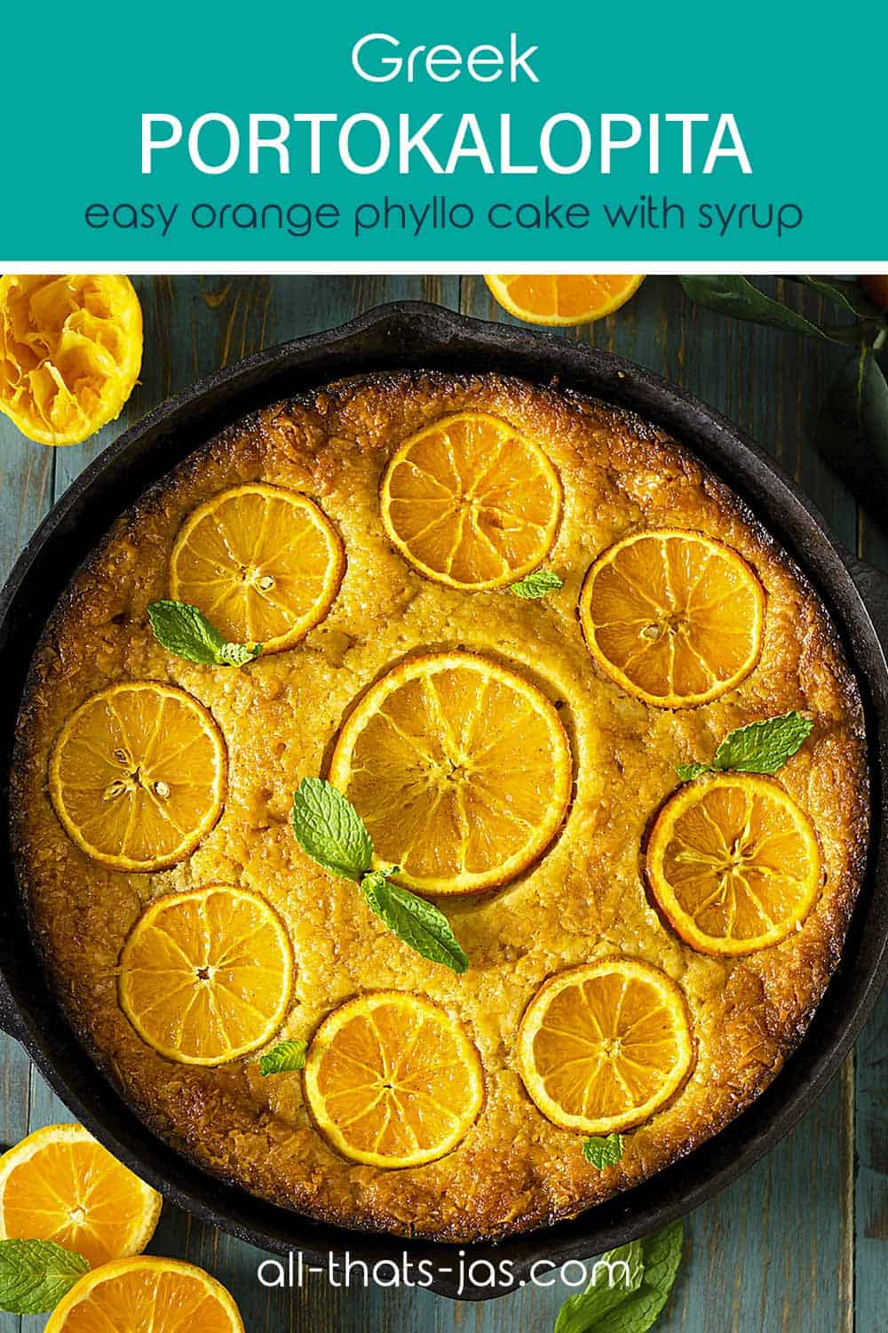 A cake in a cast-iron skillet with oranges and text overlay.