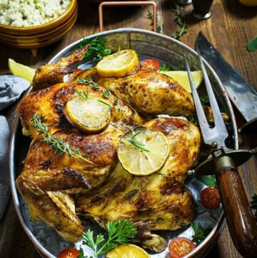 Served whole butterflied bird with herbs and lemon.