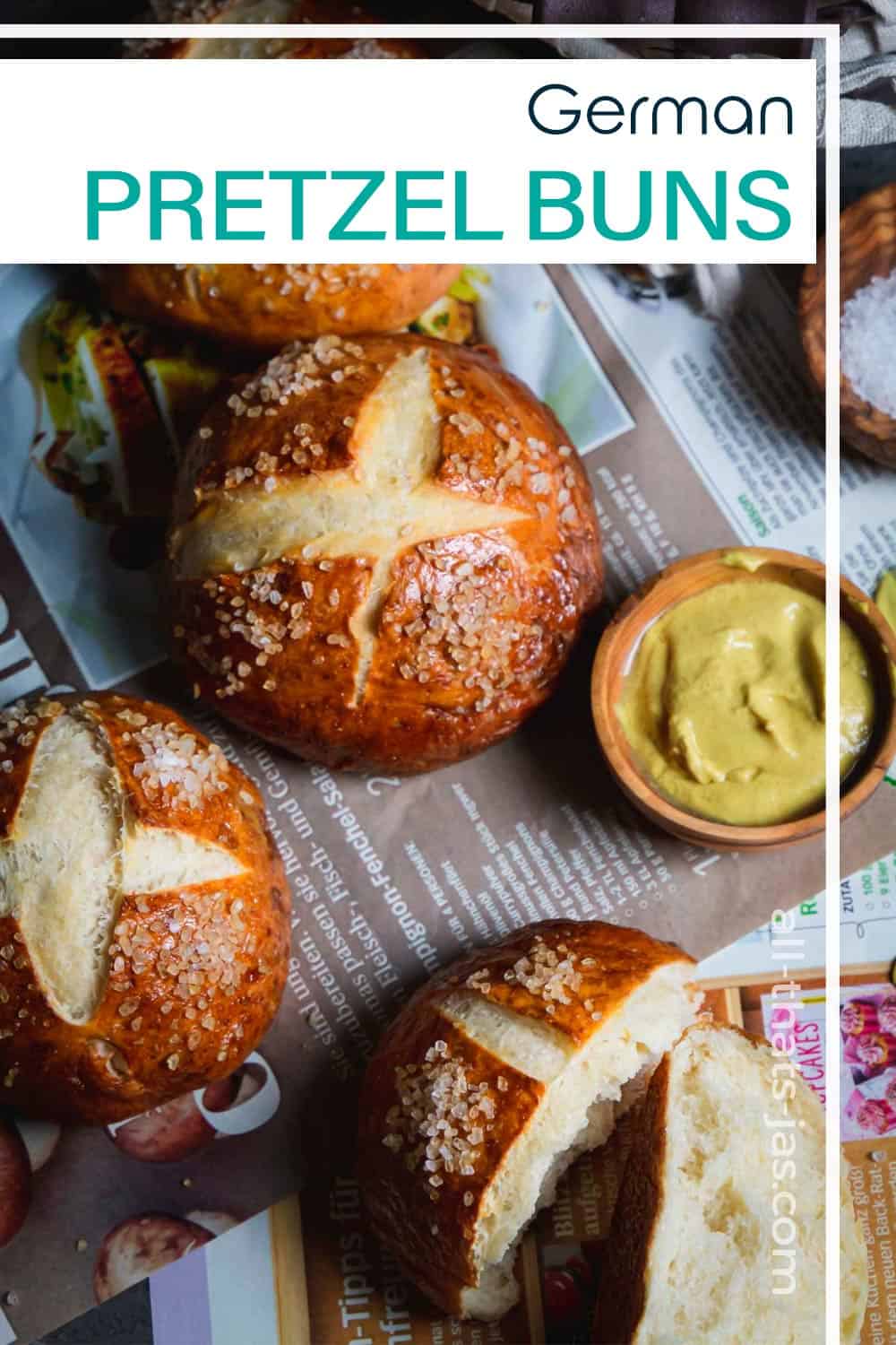 Pretzel rolls on spread on German magazine with mustard and text overlay.