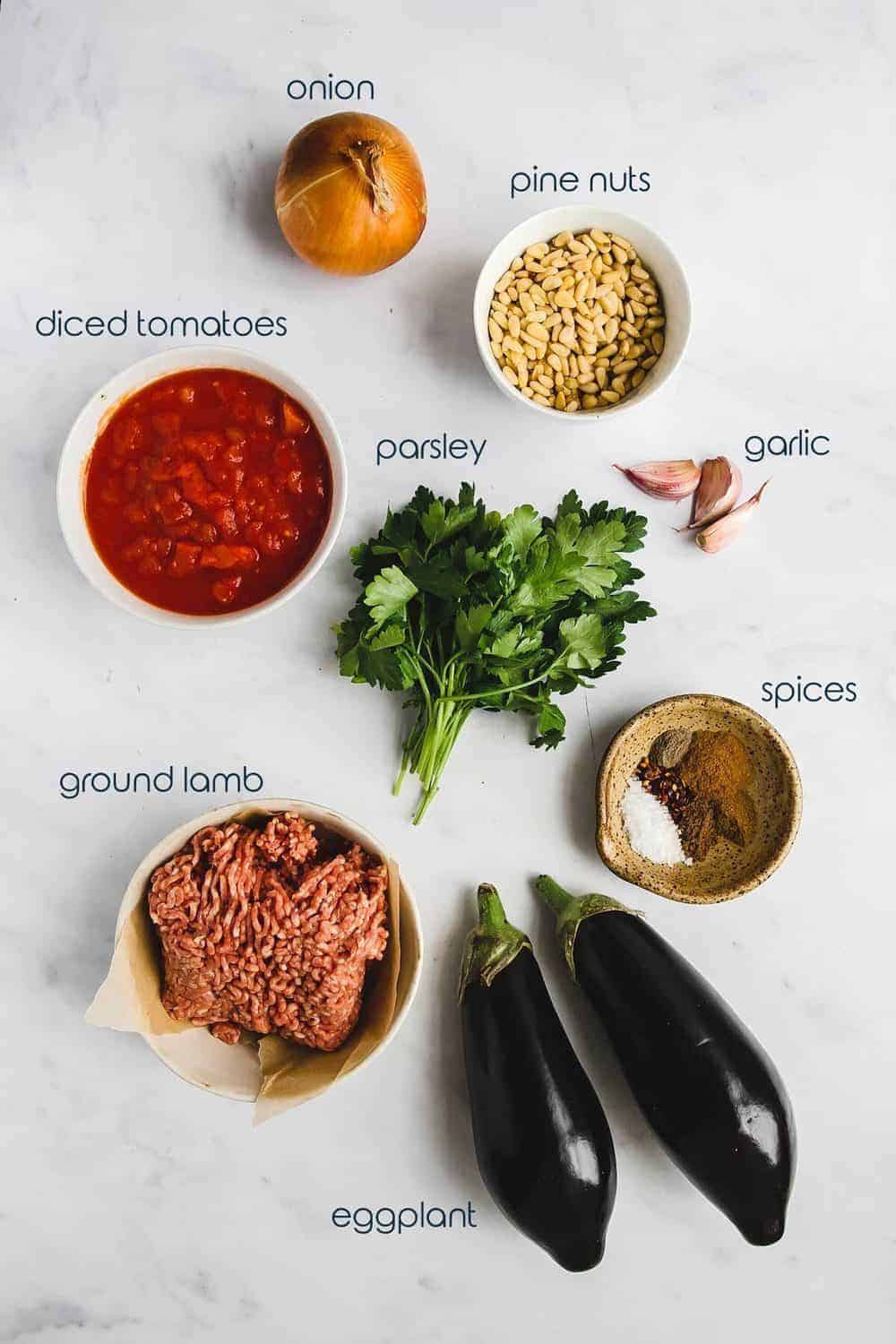 Ingredients for the stuffed eggplant with lamb recipe on the counter.