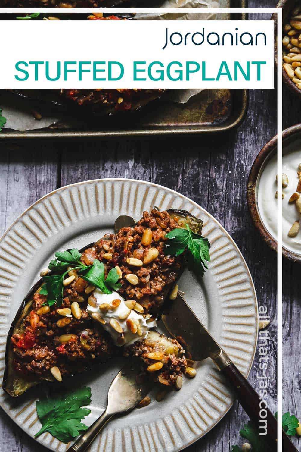 Served stuffed eggplant on a plate with text overlay.