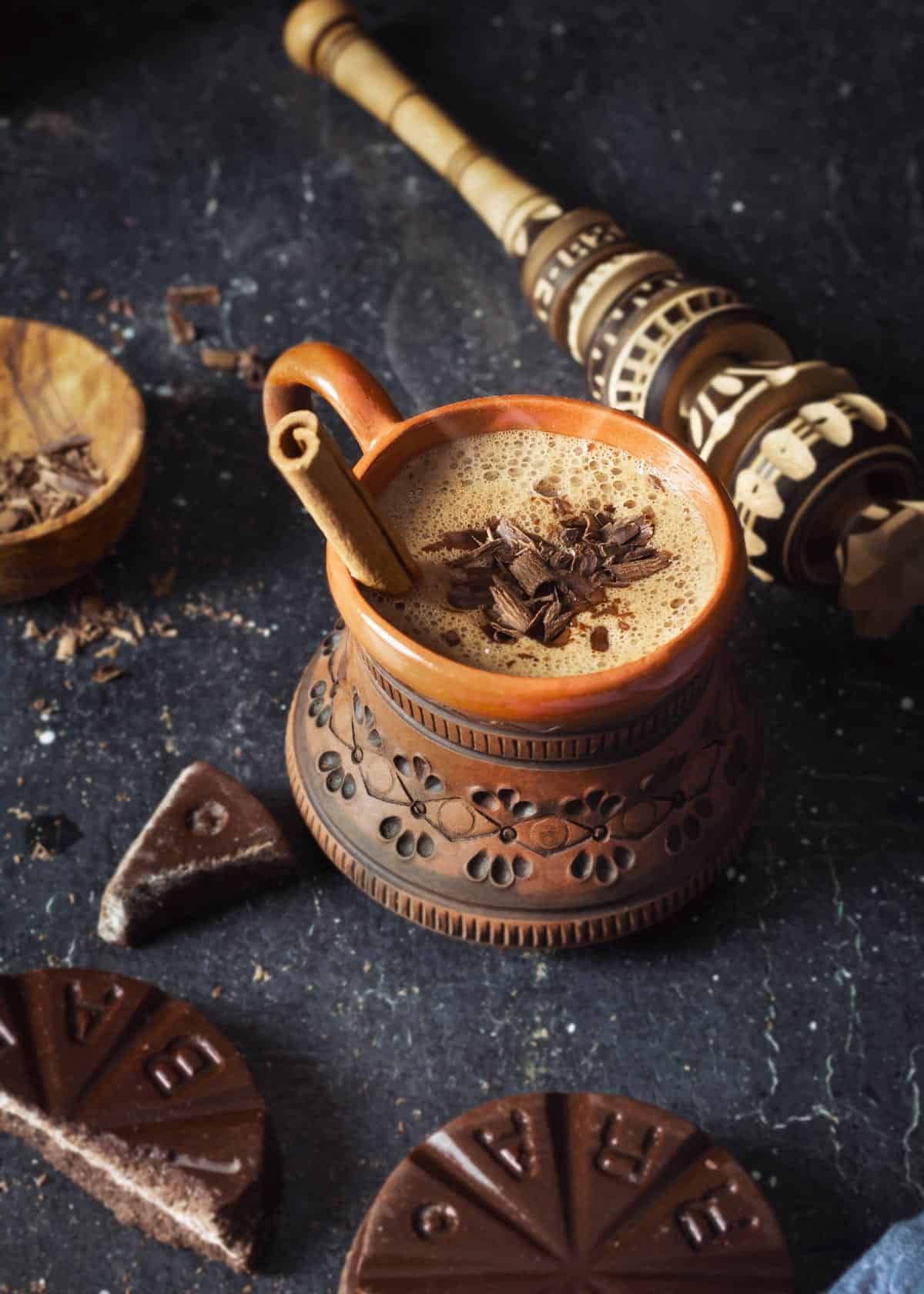 Oaxacan Mexican hot chocolate in a mug with chocolate shavings.