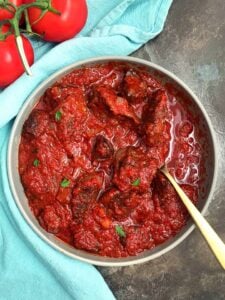 Nigerian Beef Stew in a bowl with a spoon.