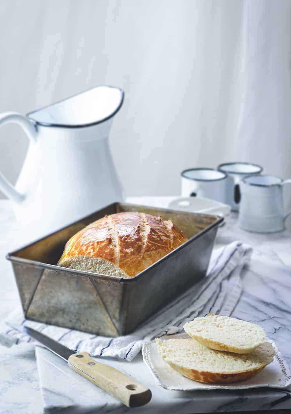 Baked milk bread without yeast in a pan on a table.