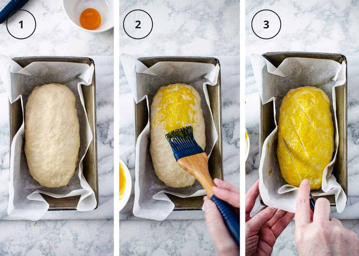 Prepping the Croatian quick bread for baking by brushing with egg yolk and scoring.