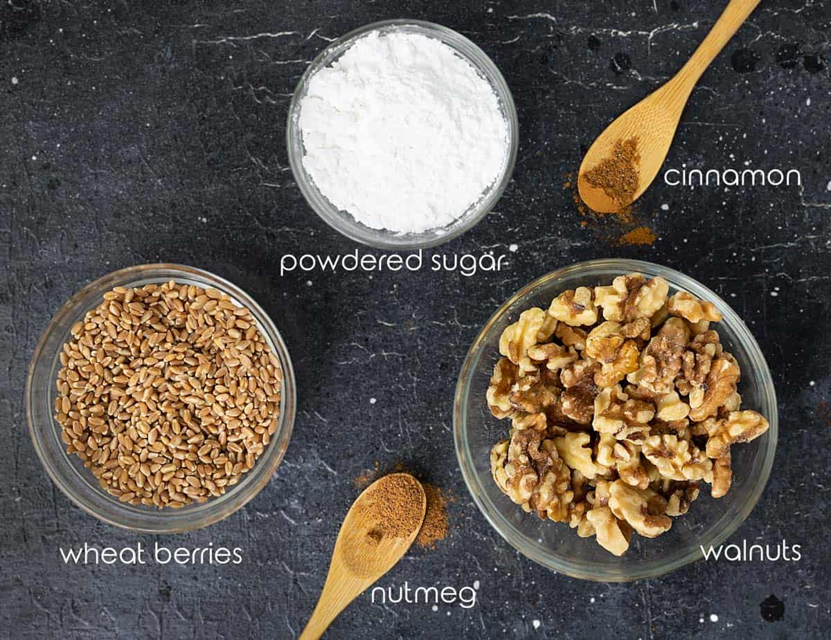 Ingredients for wheat pudding with wheat berries and walnuts on the counter.